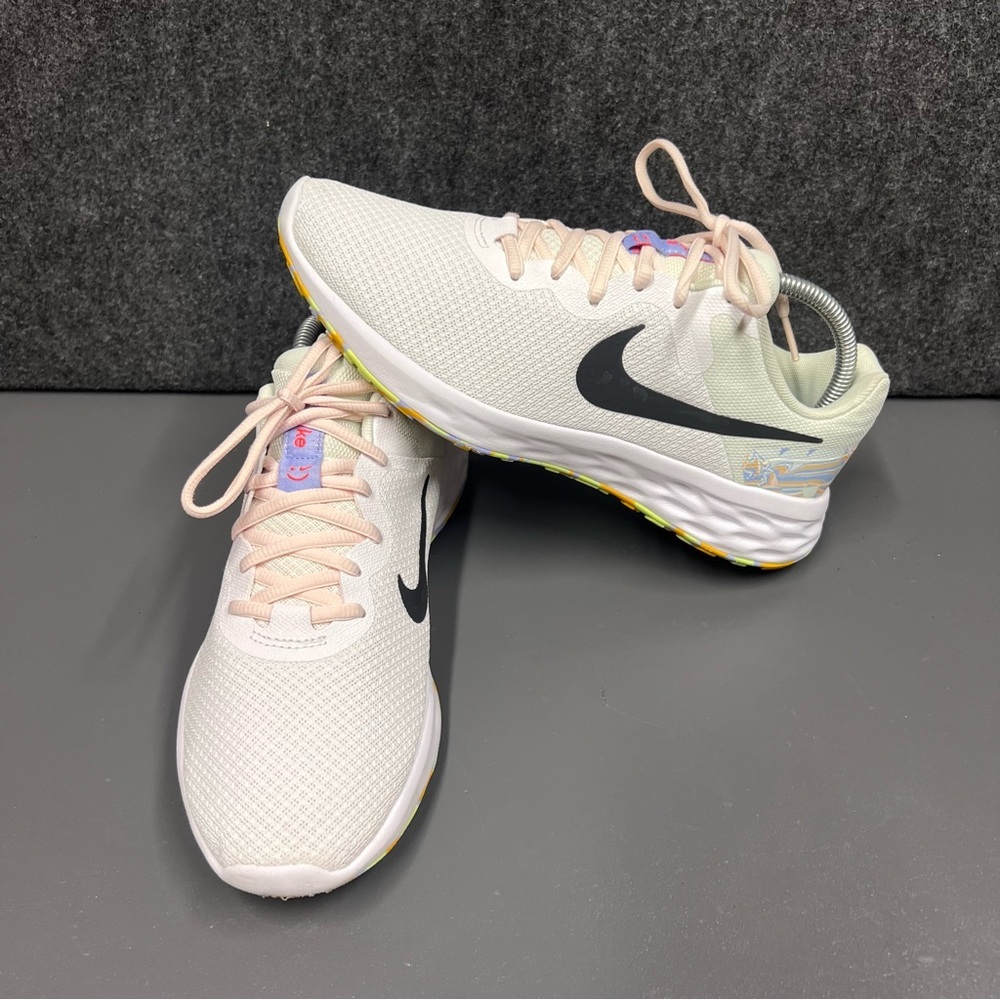 Nike Women's White Athletic Sneakers with Black Swoosh and Pastel Accents